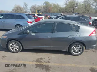 2010 Honda Insight EX with VIN JHMZE2H71AS032532, listed as a IAAI auction lot 41988221 with 333,144 mi miles and . Bid and sale history available at DreamBid. Image 14.