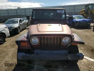2002 Jeep Wrangler Sahara with VIN 1J4FA59S12P704608, listed as a Copart auction lot 69146504 with 125,920 mi miles and Salvage Title. Bid and sale history available at carsss.com. Image 5.