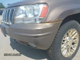 2002 Jeep Grand Cherokee Limited z VIN 1J8GW58N62C213751, wystawiony jako IAAI lot #42478869 z przebiegiem 233 848 mil mil oraz . Historia ofert i sprzedaży dostępna na DreamBid. Obrazek 6.