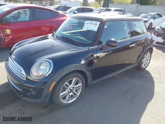 2011 MINI Cooper Hardtop with VIN WMWSU3C56BT093420, listed as a IAAI auction lot 41704260 with 142,408 mi miles. Bid and sale history available at carsss.com. Image 2.