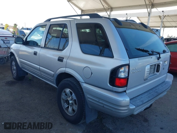 2001 Isuzu Rodeo S with VIN 4S2CK58W614361048, listed as a IAAI auction lot 41681566 with 133,460 mi miles and . Bid and sale history available at DreamBid. Image 3.