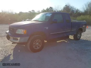 1998 Ford F-150 Standard with VIN 1FTRX18L4WKB26155, listed as a IAAI auction lot 41770257 with 319,239 mi miles. Bid and sale history available at carsss.com. Image 2.