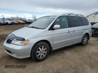 2004 Honda Odyssey EX-L z VIN 2HKRL18004H002980, wystawiony jako Copart lot #52360575 z przebiegiem 316 783 mil mil oraz Szkoda całkowita • Salvage title. Historia ofert i sprzedaży dostępna na DreamBid. Obrazek 1.