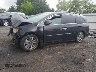 2014 Honda Odyssey Touring with VIN 5FNRL5H95EB056118, listed as a Copart auction lot 57729865 with Not provided miles and Salvage title. Bid and sale history available at DreamBid. Image 1.