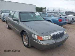 2002 Mercury Grand Marquis LS Premium z VIN 2MEFM75WX2X659825, wystawiony jako IAAI lot #41718654 z przebiegiem 141 127 mil mil oraz . Historia ofert i sprzedaży dostępna na DreamBid. Obrazek 1.