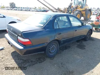 1997 Toyota Corolla with VIN 1NXBA02E7VZ601593, listed as a IAAI auction lot 42771723 with 247,823 mi miles and . Bid and sale history available at DreamBid. Image 4.