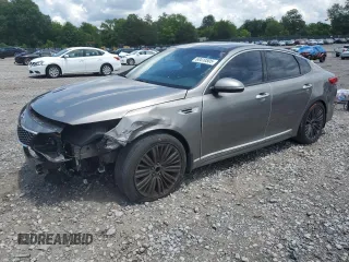 2016 Kia Optima EX with VIN 5XXGU4L31GG114663, listed as a Copart auction lot 60410505 with 129,646 mi miles and Salvage title. Bid and sale history available at DreamBid. Image 1.