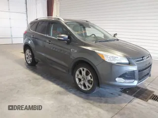 2016 Ford Escape Titanium with VIN 1FMCU9J9XGUC30596, listed as a IAAI auction lot 42024166 with 179,340 mi miles. Bid and sale history available at carsss.com. Image 1.
