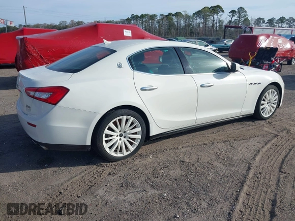 2015 Maserati Ghibli with VIN ZAM57XSA6F1156252, listed as a IAAI auction lot 41530186 with 84,417 mi miles and . Bid and sale history available at DreamBid. Image 4.