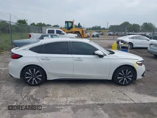 2023 Honda Civic EX-L with VIN 19XFL1H70PE014510, listed as a IAAI auction lot 42395890 with 14,163 mi miles and . Bid and sale history available at DreamBid. Image 13.
