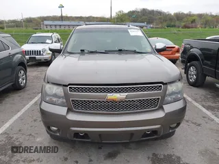 2011 Chevrolet Suburban LTZ with VIN 1GNSKKE32BR197356, listed as a IAAI auction lot 42052377 with 248,574 mi miles and . Bid and sale history available at DreamBid. Image 12.