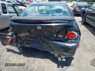 2002 Nissan Maxima GXE z VIN JN1DA31DX2T411198, wystawiony jako IAAI lot #42188090 z przebiegiem Nie podano mil oraz . Historia ofert i sprzedaży dostępna na DreamBid. Obrazek 6.