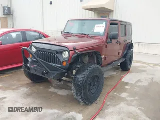 2007 Jeep Wrangler Unlimited Sahara with VIN 1J4GB59197L142223, listed as a IAAI auction lot 42025639 with 155,274 mi miles and . Bid and sale history available at DreamBid. Image 17.