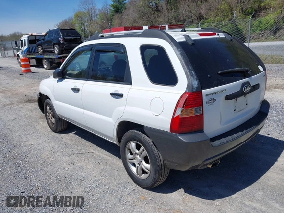 2006 Kia Sportage LX with VIN KNDJF723567151614, listed as a IAAI auction lot 42022102 with 128,564 mi miles and . Bid and sale history available at carsss.com. Image 3.