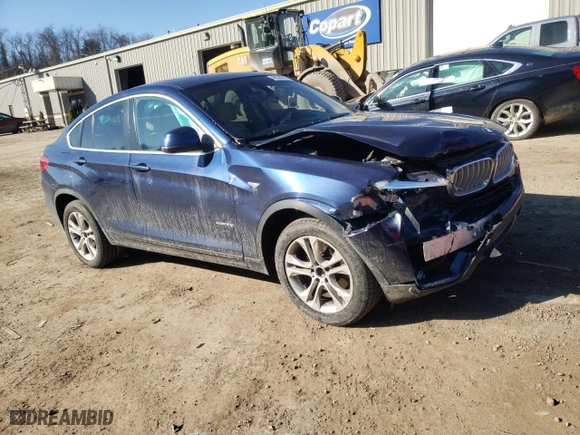 2015 BMW X4 xDrive28i with VIN 5UXXW3C59F0M88054, listed as a Copart auction lot 40534343 with 69,369 mi miles. Bid and sale history available at carsss.com. Image 4.