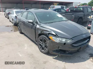 2018 Ford Fusion S z VIN 3FA6P0G74JR114938, wystawiony jako IAAI lot #41848601 z przebiegiem 160 708 mil mil oraz . Historia ofert i sprzedaży dostępna na DreamBid. Obrazek 1.