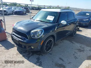 2014 MINI Countryman S z VIN WMWZC3C50EWP51835, wystawiony jako IAAI lot #42338211 z przebiegiem 137 371 mil mil oraz . Historia ofert i sprzedaży dostępna na DreamBid. Obrazek 2.