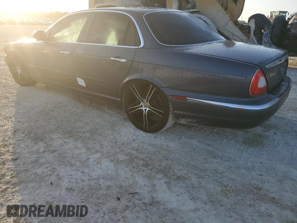 2004 Jaguar XJ with VIN SAJEA74C24SG09038, listed as a Copart auction lot 77015544 with Not Provided miles and Salvage Title. Bid and sale history available at DreamBid. Image 2.