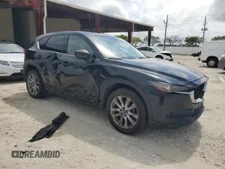 2020 Mazda CX-5 Grand Touring with VIN JM3KFBDM4L0738976, listed as a Copart auction lot 56683955 with 191,650 mi miles and Clean Title. Bid and sale history available at DreamBid. Image 4.