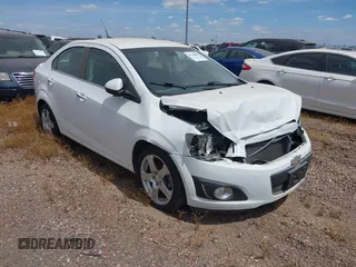 2014 Chevrolet Sonic LTZ with VIN 1G1JE5SB4E4227749, listed as a IAAI auction lot 38965556 with 69,550 mi miles. Bid and sale history available at carsss.com. Image 1.