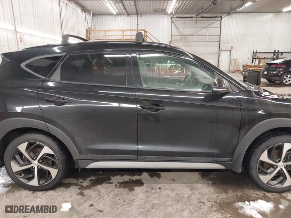 2018 Hyundai Tucson Value with VIN KM8J3CA28JU648236, listed as a IAAI auction lot 41161221 with 104,057 mi miles. Bid and sale history available at carsss.com. Image 14.