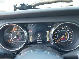 2022 Jeep Wrangler Unlimited Sahara with VIN 1C4HJXEM7NW206585, listed as a IAAI auction lot 42102516 with 10,769 mi miles and . Bid and sale history available at DreamBid. Image 7.