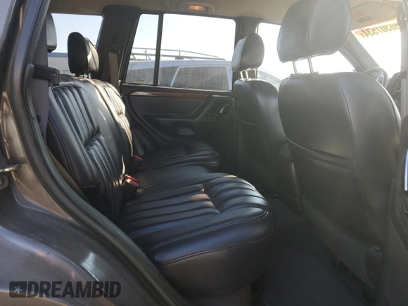1999 Jeep Grand Cherokee Limited with VIN 1J4G268SXXC759016, listed as a Copart auction lot 80307534 with 215,870 mi miles and Salvage title. Bid and sale history available at DreamBid. Image 11.
