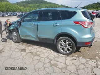 2013 Ford Escape SEL z VIN 1FMCU9H98DUC56048, wystawiony jako Copart lot #61613085 z przebiegiem 198 102 mil mil oraz Szkoda całkowita • Salvage title. Historia ofert i sprzedaży dostępna na DreamBid. Obrazek 2.