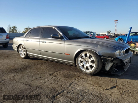 2004 Jaguar XJ with VIN SAJWA71C74SG20299, listed as a Copart auction lot 79469504 with 78,134 mi miles and Salvage Title. Bid and sale history available at carsss.com. Image 4.
