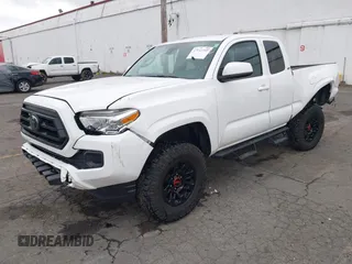 2022 Toyota Tacoma SR with VIN 3TYSX5EN1NT010664, listed as a IAAI auction lot 41642295 with 29,848 mi miles and . Bid and sale history available at DreamBid. Image 2.