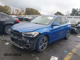 2016 BMW X1 xDrive28i with VIN WBXHT3C31G5E55119, listed as a IAAI auction lot 40894704 with 126,561 mi miles. Bid and sale history available at carsss.com. Image 2.