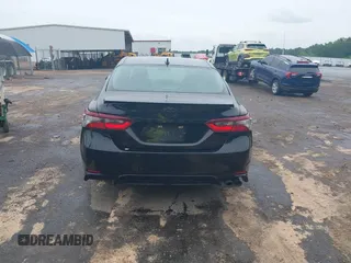 2023 Toyota Camry SE with VIN 4T1G11AKXPU827360, listed as a IAAI auction lot 42217356 with 57,497 mi miles and . Bid and sale history available at DreamBid. Image 16.