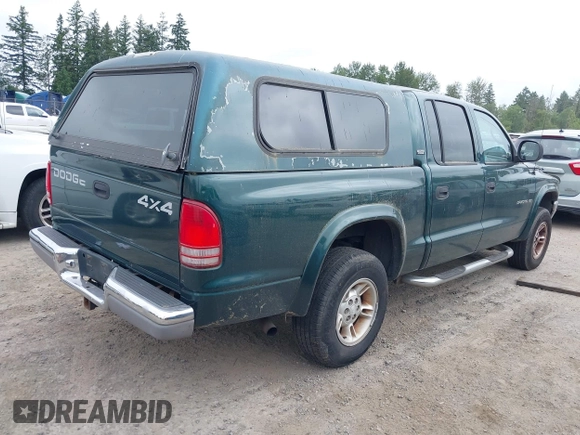 2000 Dodge Dakota Sport z VIN 1B7GG2AN4YS760836, wystawiony jako IAAI lot #42472312 z przebiegiem 230 401 mil mil oraz . Historia ofert i sprzedaży dostępna na DreamBid. Obrazek 4.