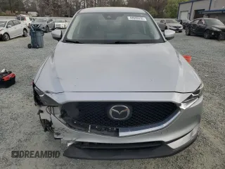 2021 Mazda CX-5 Touring with VIN JM3KFACM2M0451083, listed as a Copart auction lot 49999935 with 59,927 mi miles and Salvage Title. Bid and sale history available at carsss.com. Image 5.