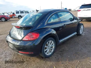 2018 Volkswagen Beetle S with VIN 3VWFD7ATXJM706338, listed as a IAAI auction lot 41293181 with 71,945 mi miles. Bid and sale history available at carsss.com. Image 4.