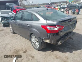 2014 Ford Focus Titanium with VIN 1FADP3J21EL299718, listed as a IAAI auction lot 41788080 with 91,748 mi miles. Bid and sale history available at carsss.com. Image 3.