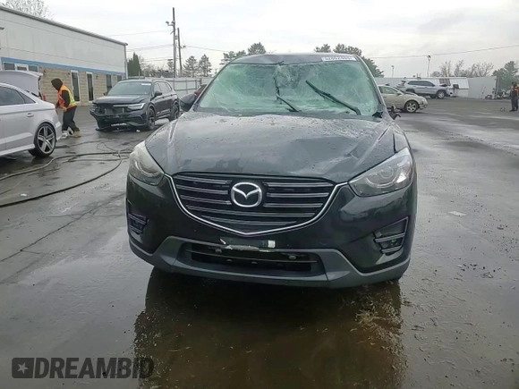 2016 Mazda CX-5 Grand Touring with VIN JM3KE4DYXG0711367, listed as a Copart auction lot 52862405 with 87,870 mi miles and Salvage Title. Bid and sale history available at DreamBid. Image 13.