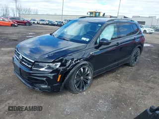 2021 Volkswagen Tiguan SE with VIN 3VV2B7AX1MM101432, listed as a IAAI auction lot 41982286 with 72,252 mi miles and . Bid and sale history available at DreamBid. Image 2.