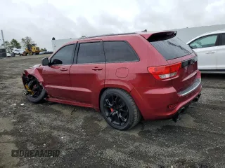 2012 Jeep Grand Cherokee SRT8 with VIN 1C4RJFDJ0CC351195, listed as a Copart auction lot 72794454 with 104,672 mi miles and Salvage Title. Bid and sale history available at carsss.com. Image 2.