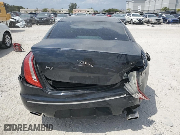 2012 Jaguar XJ with VIN SAJWA1CB5CLV27448, listed as a Copart auction lot 53373985 with 90,603 mi miles and Salvage Title. Bid and sale history available at DreamBid. Image 6.