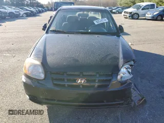 2005 Hyundai Accent GLS with VIN KMHCG45C15U662362, listed as a Copart auction lot 80574774 with 122,898 mi miles and Salvage Title. Bid and sale history available at carsss.com. Image 5.