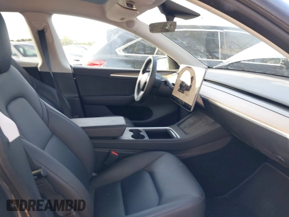 2023 Tesla Model Y Long Range with VIN 7SAYGDEE1PA053215, listed as a IAAI auction lot 41476973 with 58,025 mi miles and . Bid and sale history available at DreamBid. Image 5.