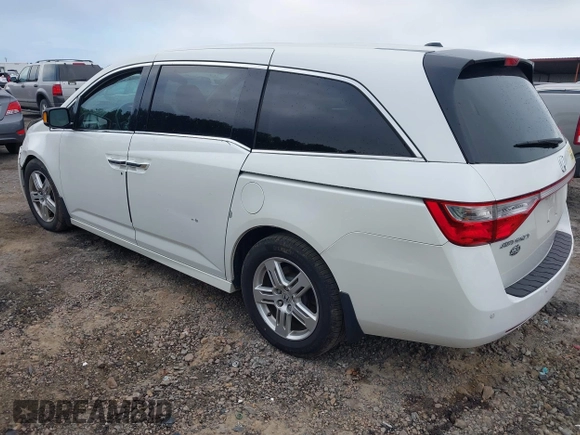 2012 Honda Odyssey Touring with VIN 5FNRL5H93CB034485, listed as a IAAI auction lot 42304502 with 198,589 mi miles and . Bid and sale history available at DreamBid. Image 3.