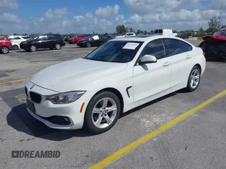 2015 BMW 4 Series 428i xDrive with VIN WBA4C9C56FG135520, listed as a IAAI auction lot 41574336 with 70,870 mi miles and . Bid and sale history available at carsss.com. Image 2.