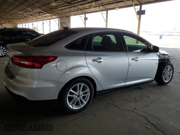 2015 Ford Focus SE with VIN 1FADP3F20FL232196, listed as a Copart auction lot 64829835 with 31,294 mi miles and Salvage title. Bid and sale history available at DreamBid. Image 3.