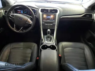 2015 Ford Fusion SE z VIN 3FA6P0H98FR295646, wystawiony jako Copart lot #57055105 z przebiegiem 121 515 mil mil oraz Szkoda całkowita • Salvage title. Historia ofert i sprzedaży dostępna na DreamBid. Obrazek 8.