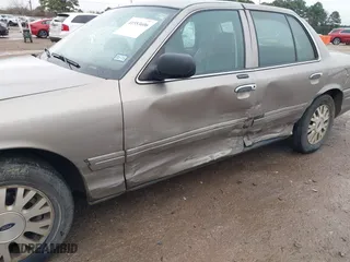 2005 Ford Crown Victoria LX with VIN 2FAFP74W05X174758, listed as a IAAI auction lot 41553606 with 192,103 mi miles. Bid and sale history available at carsss.com. Image 6.