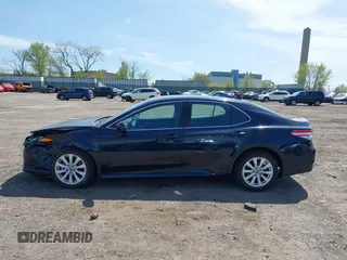 2019 Toyota Camry LE with VIN 4T1B11HK6KU276644, listed as a IAAI auction lot 42037249 with 23,677 mi miles and . Bid and sale history available at DreamBid. Image 14.