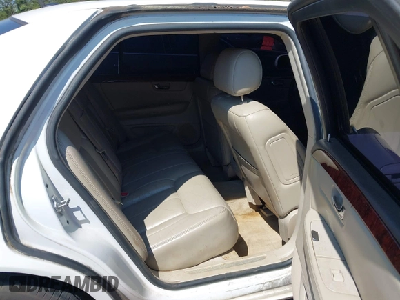 2006 Cadillac DTS w/1SC with VIN 1G6KD57Y36U116528, listed as a IAAI auction lot 42063595 with 128,839 mi miles. Bid and sale history available at carsss.com. Image 8.