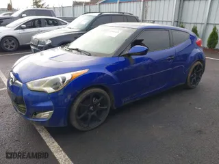 2012 Hyundai Veloster w/Black Int with VIN KMHTC6AD5CU027793, listed as a IAAI auction lot 41881333 with 134,984 mi miles. Bid and sale history available at carsss.com. Image 2.